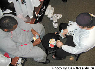 Atlanta Falcons linemen Ephraim Salaam, left, and Todd McClure play the popular family card game UNO daily in the teams locker room.