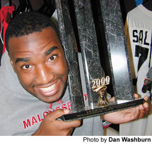 Ephraim Salaam is rather proud of his UNO trophy.